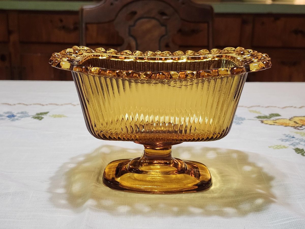 Orange/brown tinted glass dish on a kitchen table.