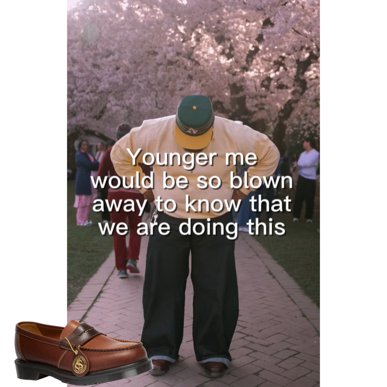 A person posing in front of a cherry blossom tree. He is wearing a green hat, a yellow shirts, jeans, and brown shoes. A cutout of a brown shoe is in the bottom left corner.