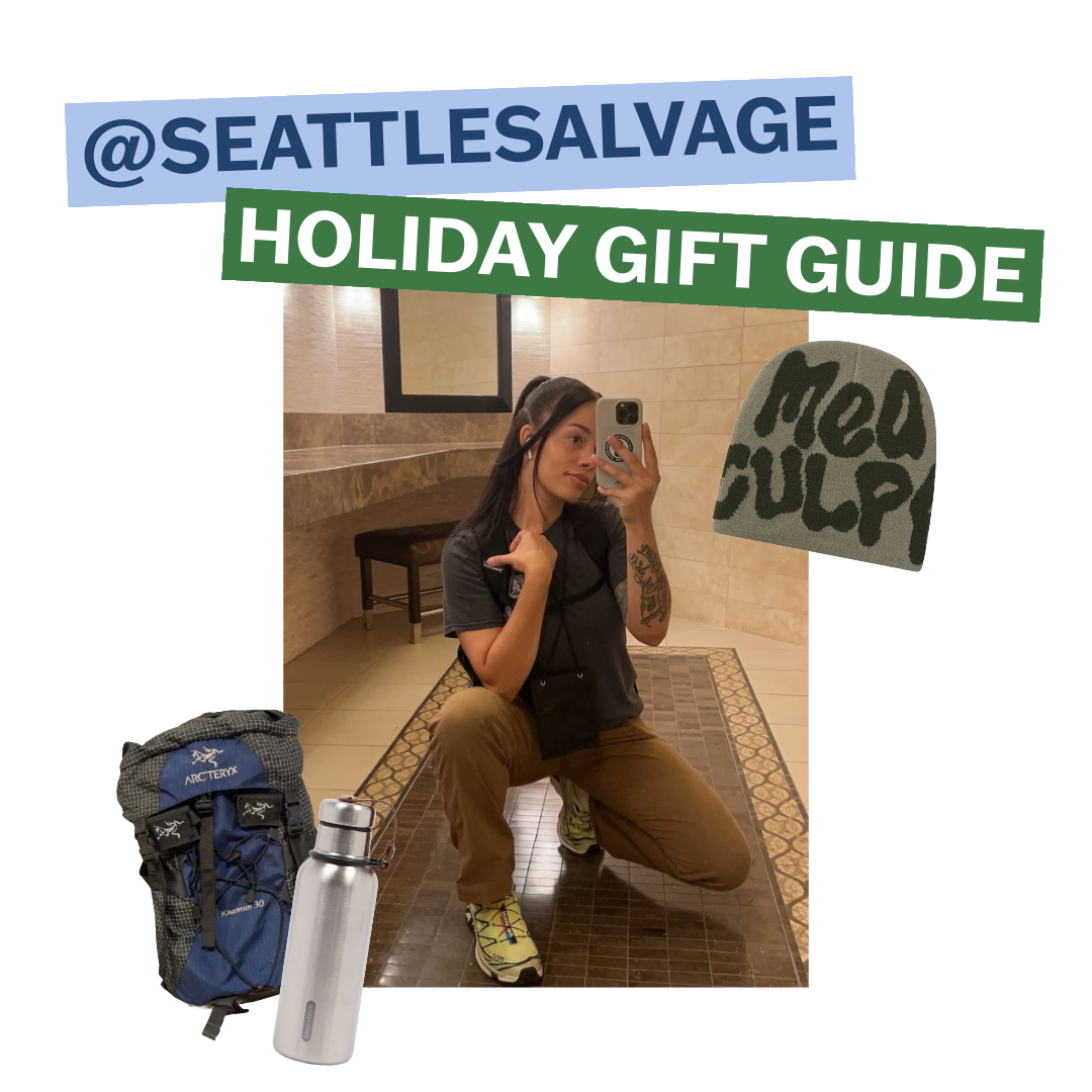 The text reads "@SEATTLESALVAGE HOLIDAY GIFT GUIDE". There is a photo of Nichole of Seattle salvage in the center, posing in front of a mirror. There are cutouts of a blue and grey backpack, a stainless steel water bottle, and an army green beanie.