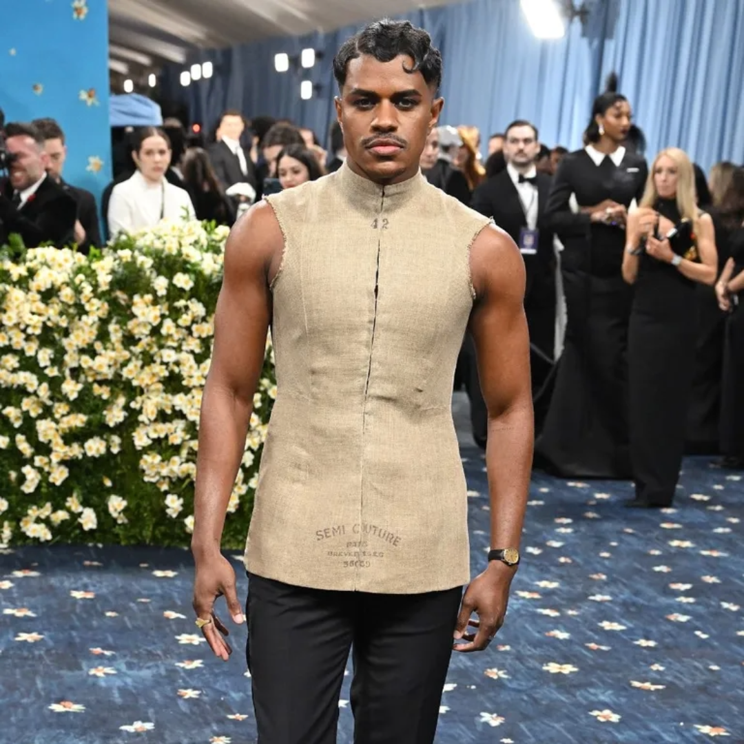 Image of actor Jeremy Pope wearing a beige top and custom eBay tailored trousers at the Met Gala.